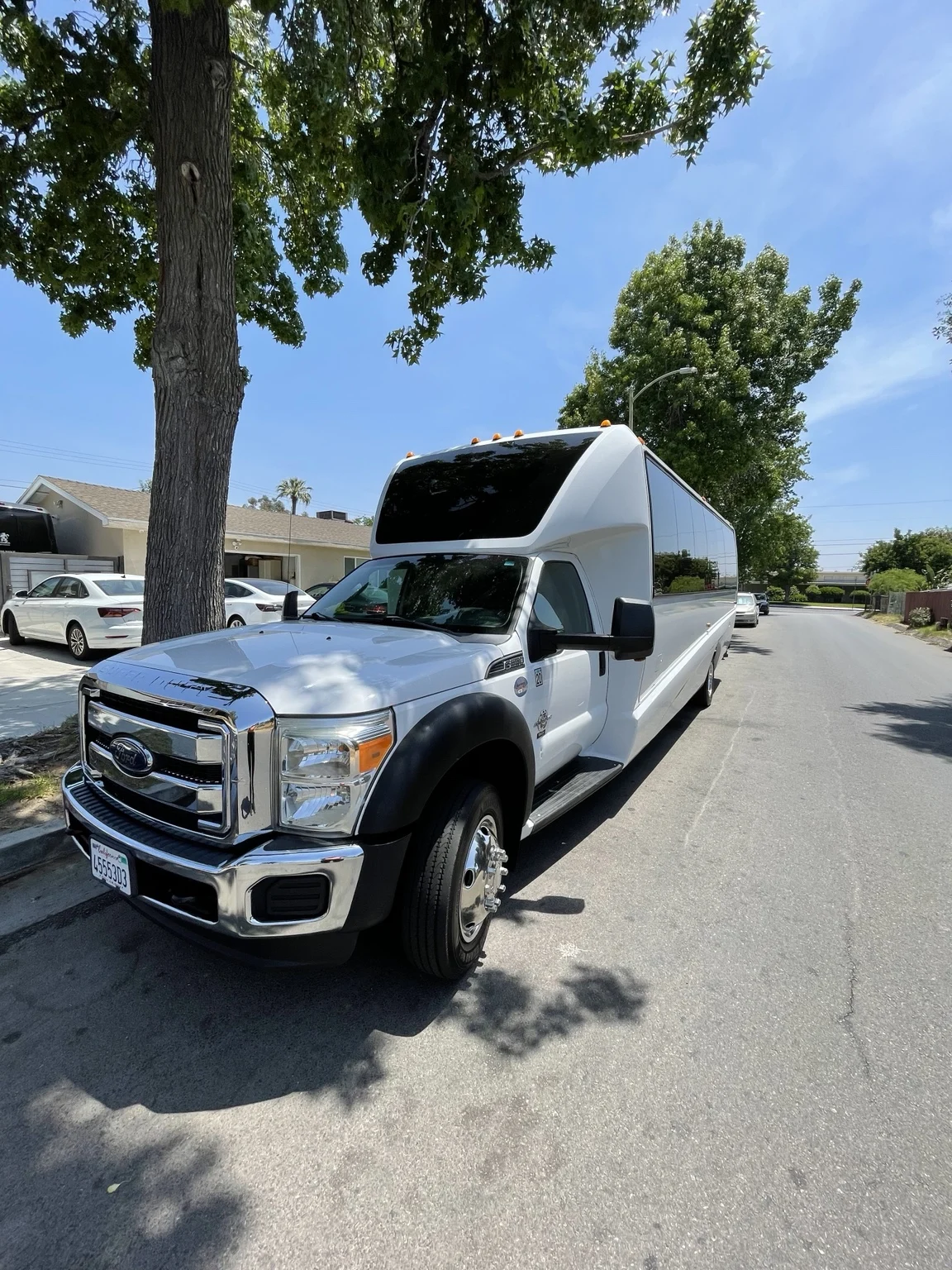 White Ford party bus parked outdoors