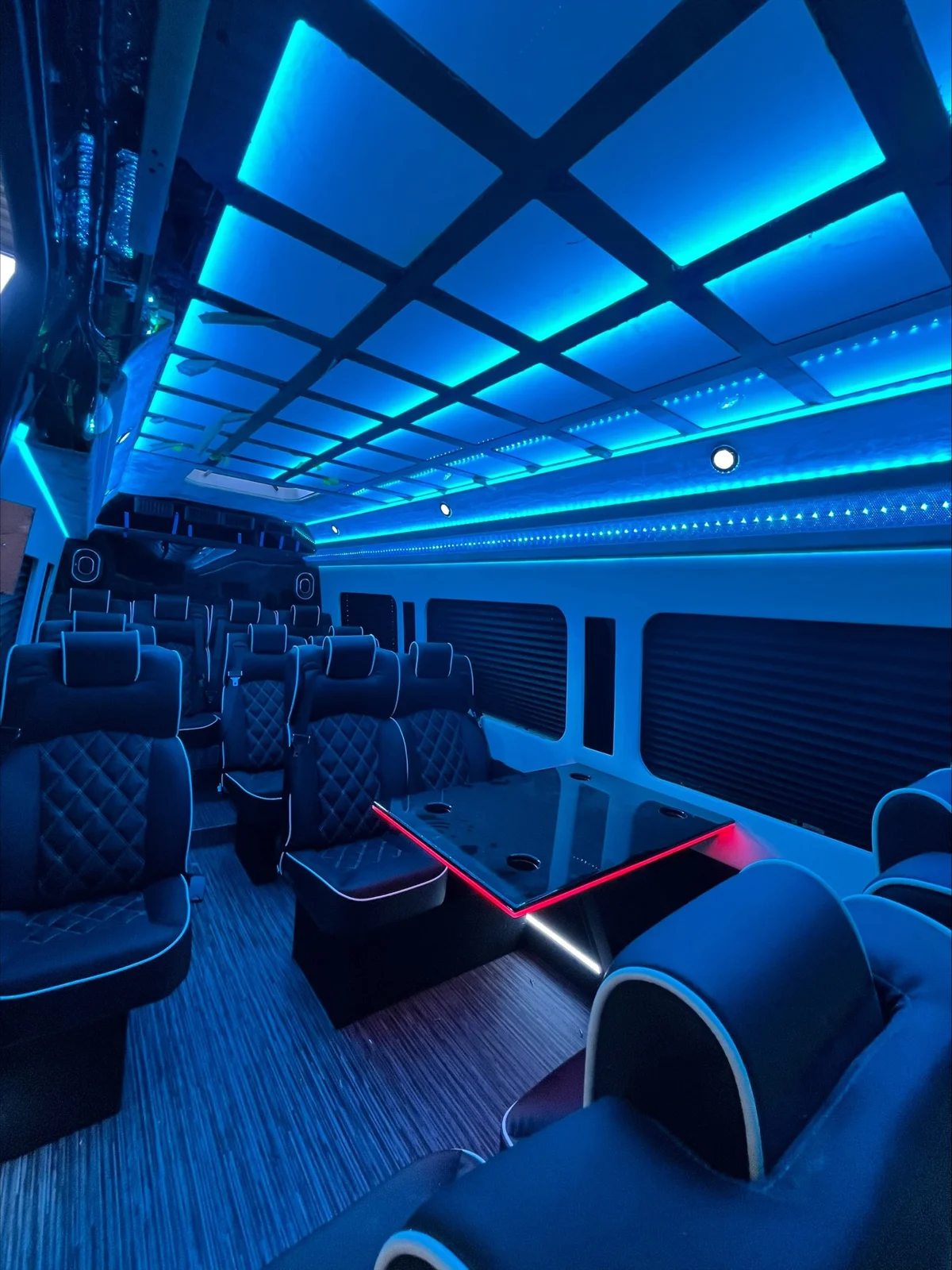 Party bus interior with blue accent lighting